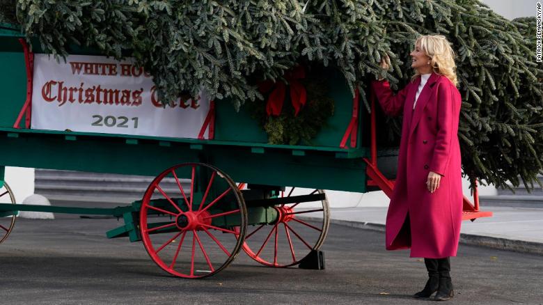 First lady Jill Biden receives the official 2021 White House Christmas tree at the White House, Monday, Nov. 22, 2021, in Washington. This year???s tree is an 18.5-foot Fraser fir presented by Rusty and Beau Estes of Peak Farms in Jefferson, N.C. (AP Photo/Patrick Semansky)